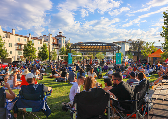 Family and friends come together to enjoy an evening of music at Jazz in the Park, presented by Playhouse Village Foundation.